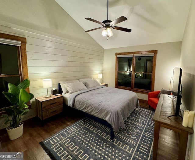 bedroom with vaulted ceiling, dark wood-type flooring, and ceiling fan