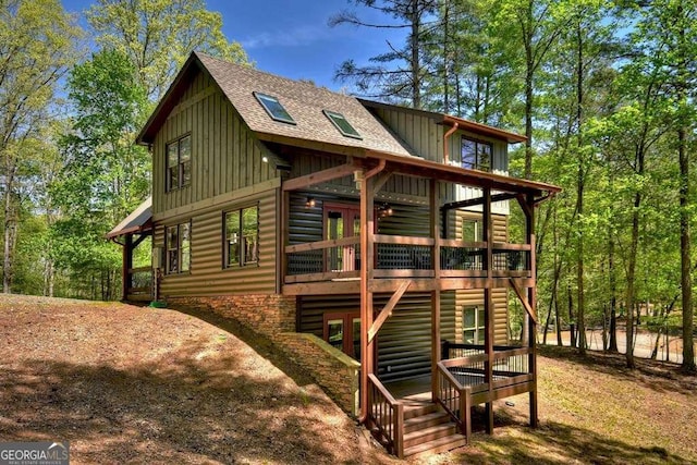 view of home's exterior with a wooden deck