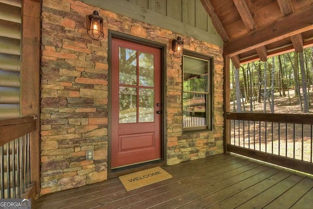 doorway to property featuring covered porch