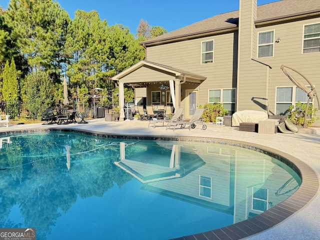 view of swimming pool featuring a patio area