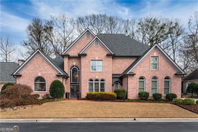 front facade with a front yard