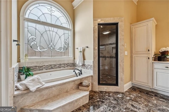 bathroom with vanity, crown molding, and separate shower and tub