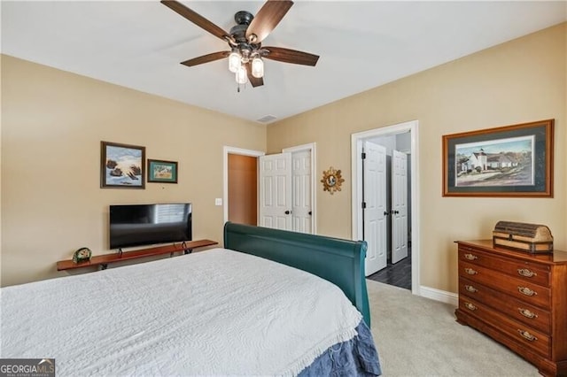 carpeted bedroom featuring ceiling fan