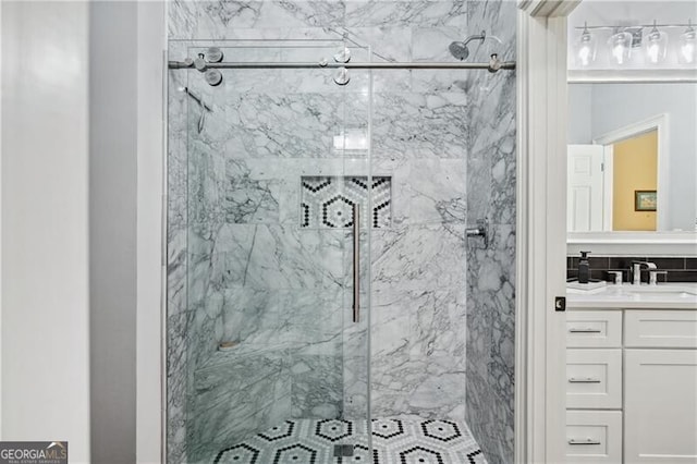 bathroom featuring vanity and an enclosed shower