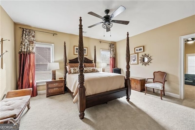 bedroom featuring ceiling fan and light colored carpet