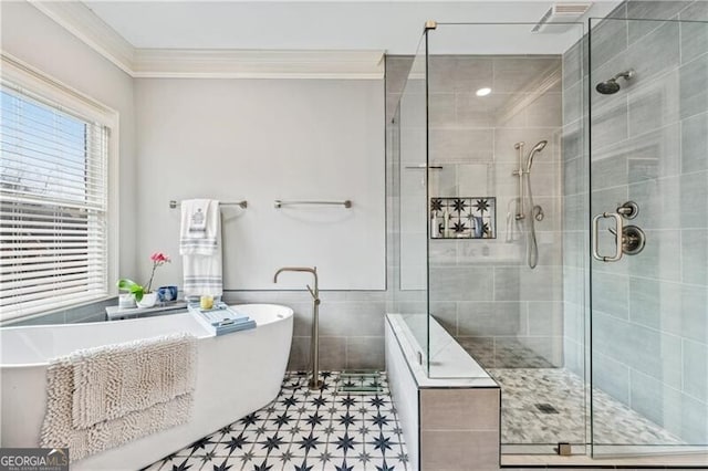 bathroom featuring ornamental molding, tile walls, and plus walk in shower