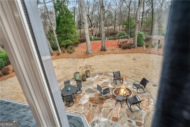 view of patio featuring an outdoor fire pit