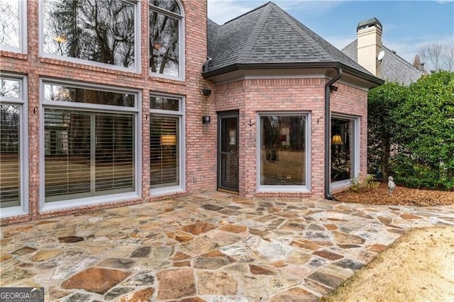 rear view of house with a patio