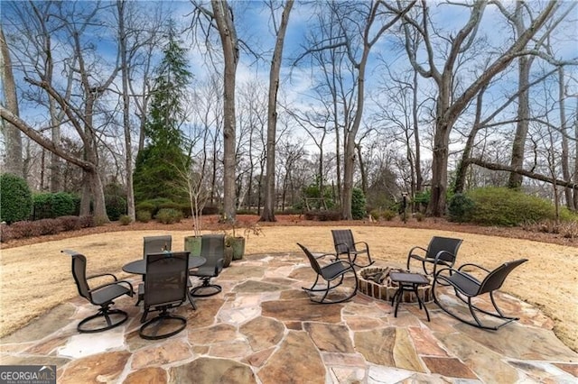 view of patio featuring an outdoor fire pit