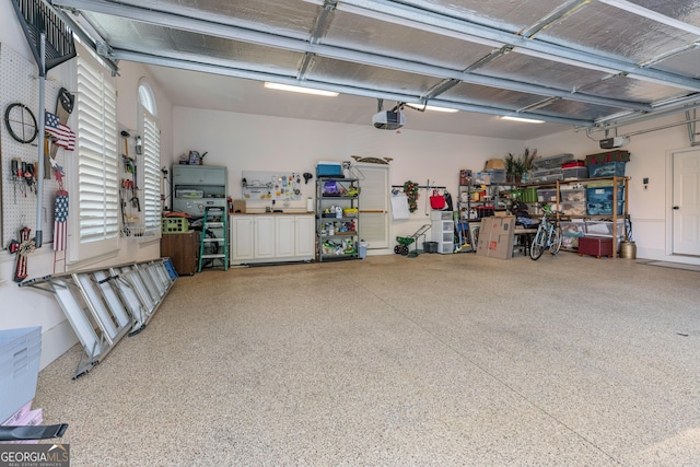 9135 Etching Overlook, Johns Creek, GA 30097 - garage featuring a garage door opener