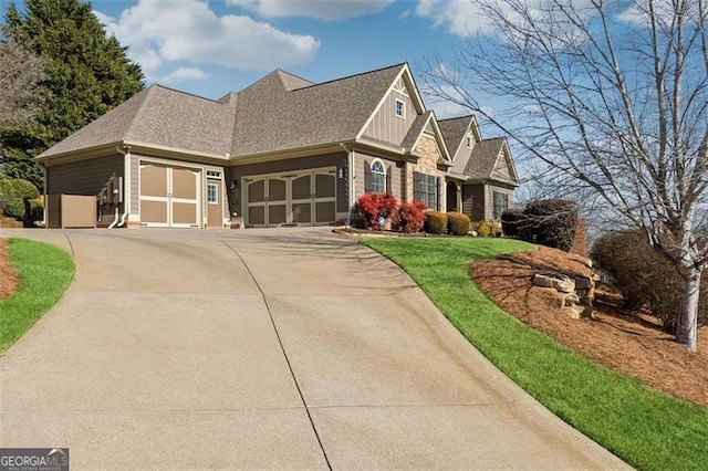 view of front of home with a garage and a front yard