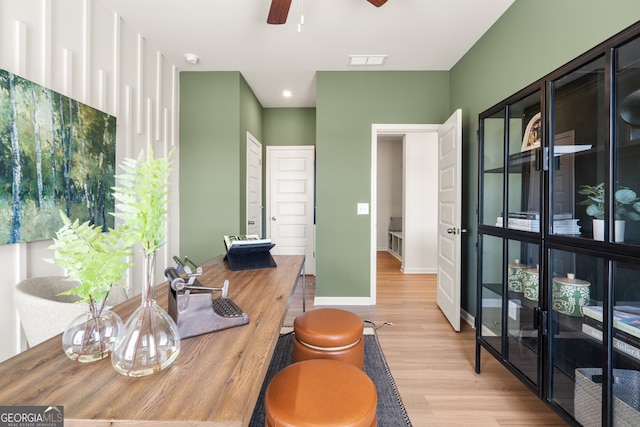 bathroom featuring wood-type flooring and ceiling fan