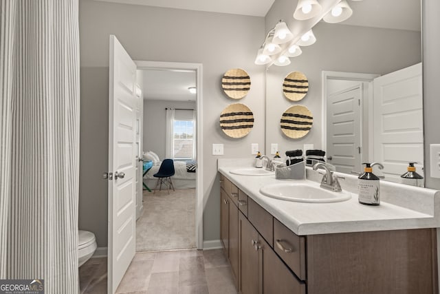 bathroom with vanity and toilet