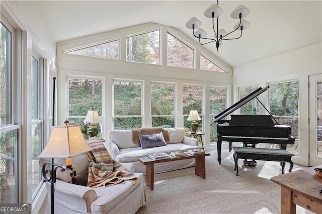 sunroom with an inviting chandelier and lofted ceiling