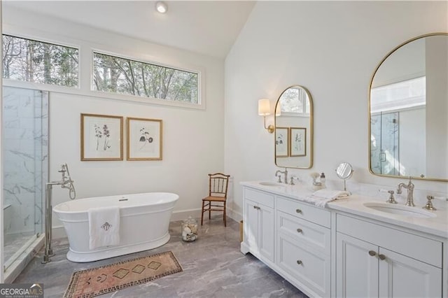 bathroom with vaulted ceiling, vanity, and separate shower and tub