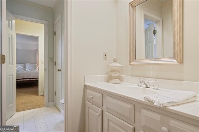 bathroom featuring vanity, toilet, and tile patterned flooring