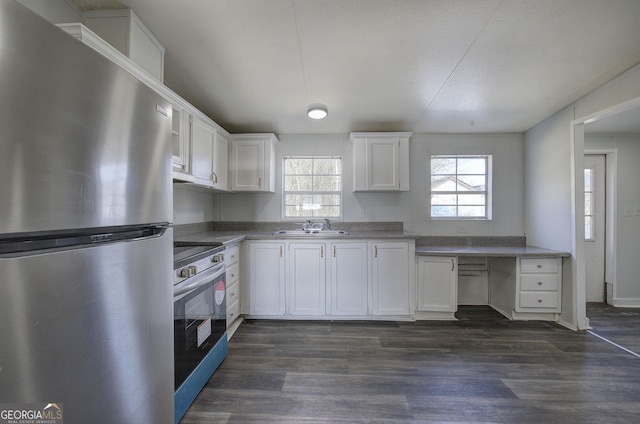 kitchen with white cabinetry, sink, dark hardwood / wood-style flooring, and stainless steel appliances