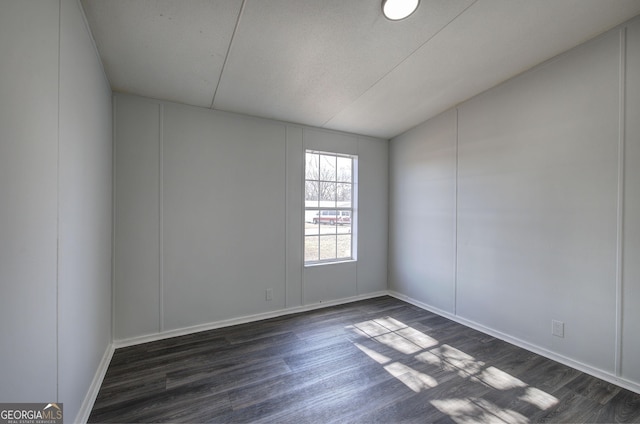 empty room featuring dark hardwood / wood-style floors