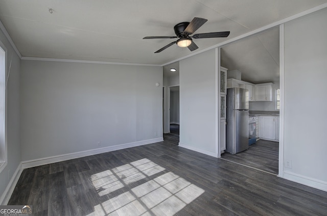 unfurnished living room with ceiling fan, ornamental molding, and dark hardwood / wood-style floors