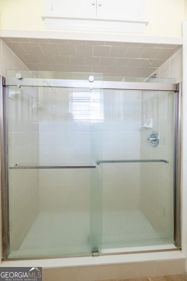 bathroom featuring an enclosed shower