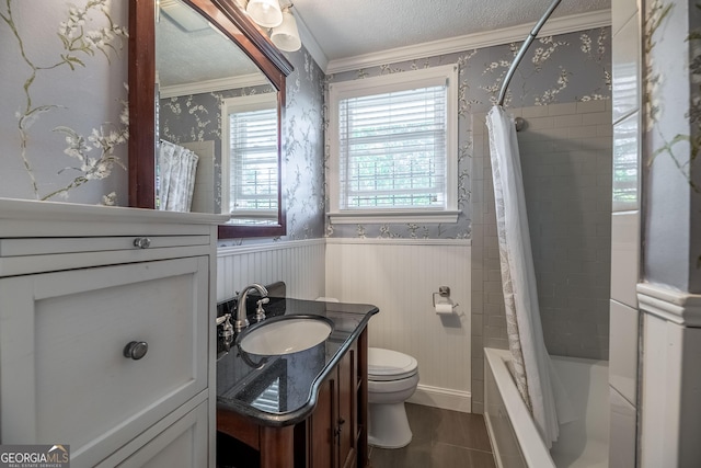 full bathroom with toilet, crown molding, a textured ceiling, vanity, and shower / bath combo with shower curtain