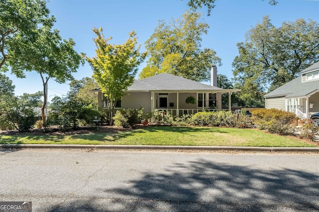 view of front of home with a front lawn and covered porch