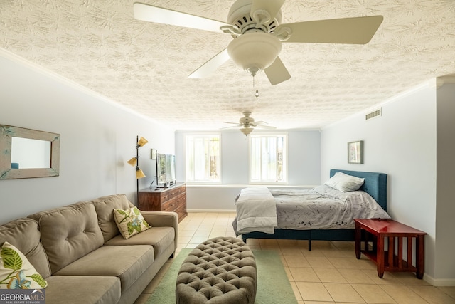 tiled bedroom featuring a textured ceiling, ornamental molding, and ceiling fan