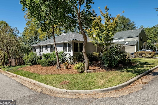 ranch-style house with a front lawn