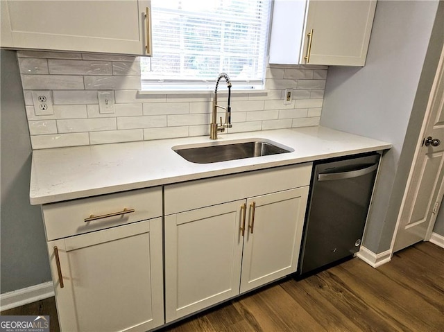 kitchen with sink, white cabinets, dark hardwood / wood-style flooring, decorative backsplash, and stainless steel dishwasher