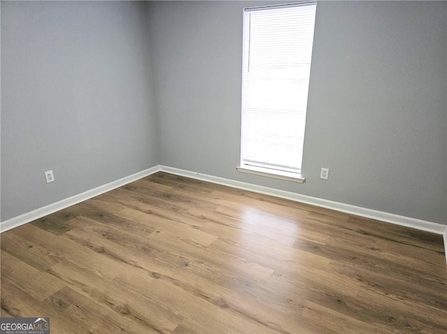 empty room featuring hardwood / wood-style flooring