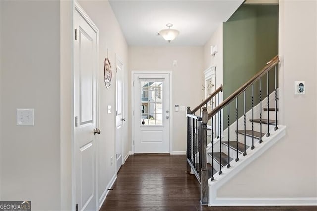 entrance foyer featuring dark hardwood / wood-style floors