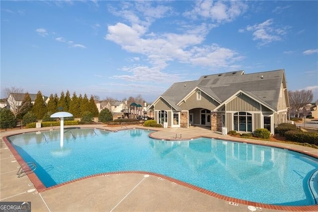 view of swimming pool with a patio