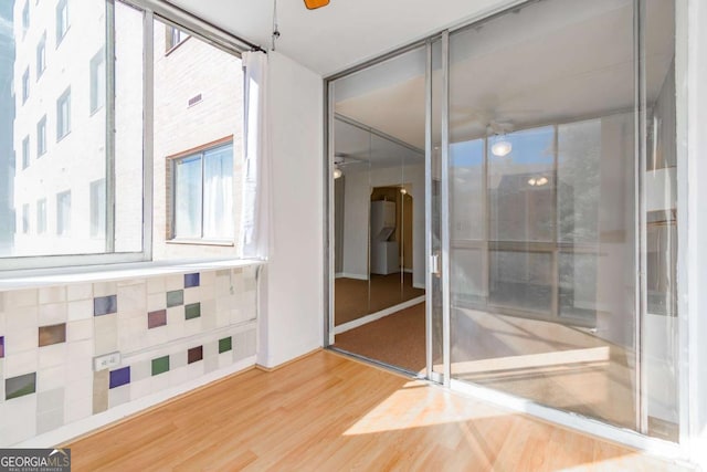 empty room featuring hardwood / wood-style flooring and ceiling fan