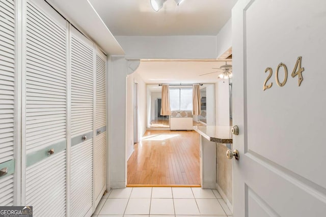 hallway with light tile patterned floors