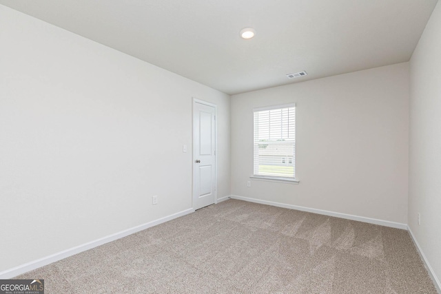 unfurnished room featuring carpet floors