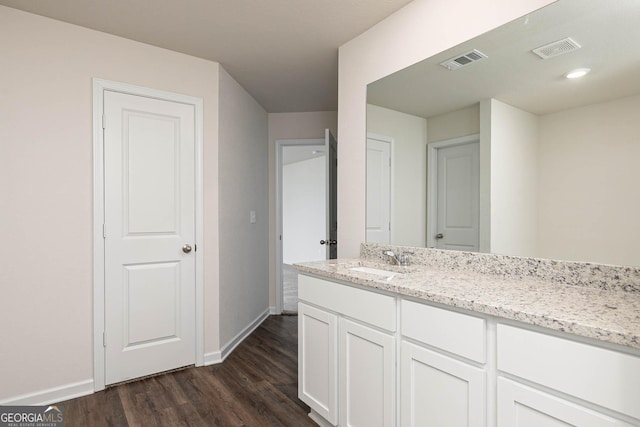 bathroom with wood-type flooring and vanity