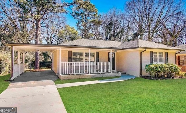 ranch-style home featuring a carport, a porch, and a front lawn