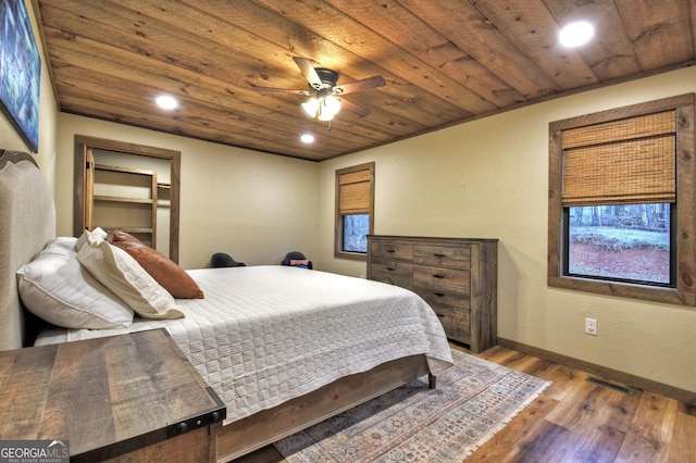 bedroom featuring wood ceiling and light hardwood / wood-style floors