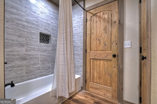 bathroom featuring shower / tub combo with curtain