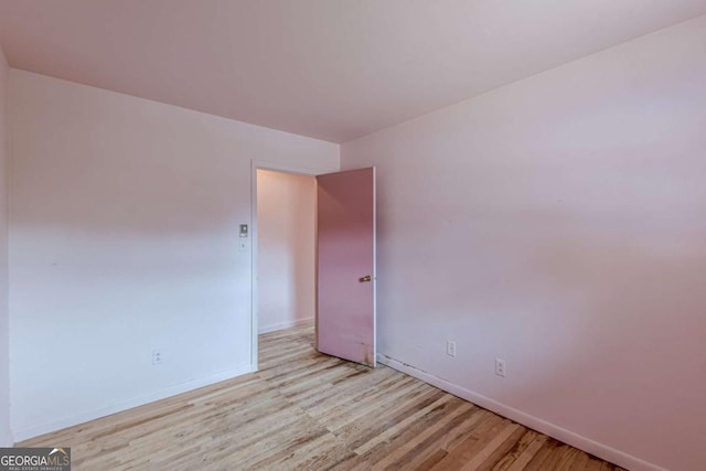 spare room with light hardwood / wood-style floors