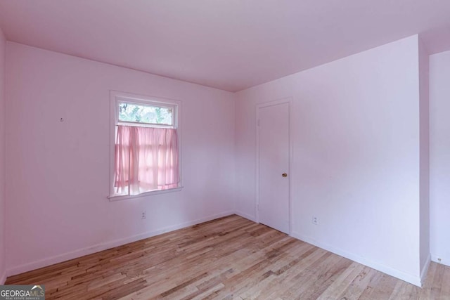 spare room with light hardwood / wood-style flooring