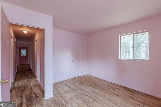 unfurnished room featuring light hardwood / wood-style floors