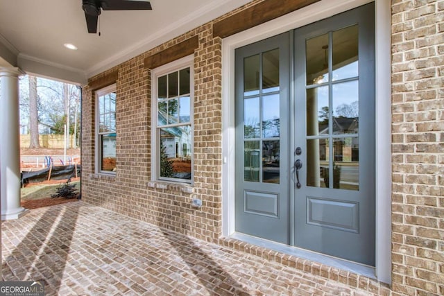 entrance to property with french doors and ceiling fan