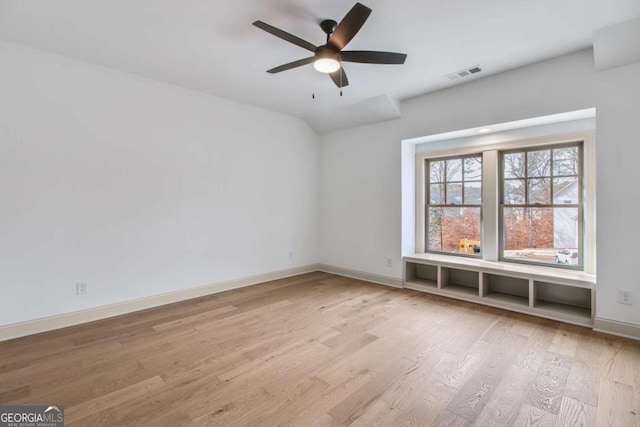 unfurnished room with ceiling fan and light wood-type flooring