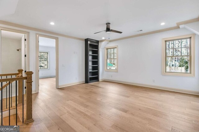 unfurnished living room featuring light hardwood / wood-style floors and ceiling fan