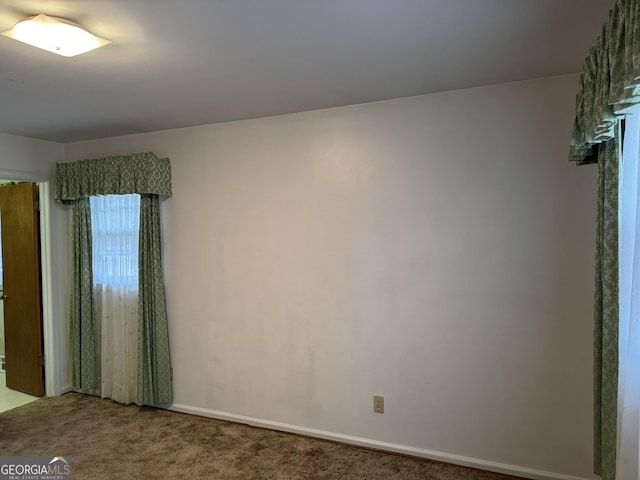 unfurnished room with carpet floors