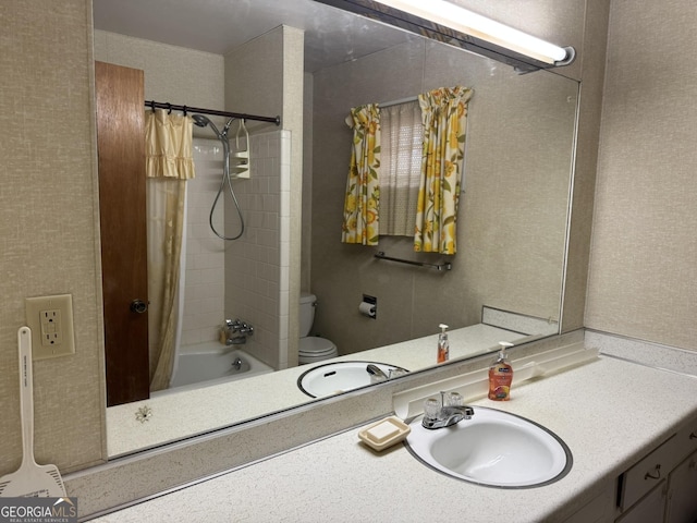 full bathroom with sink, shower / bath combination with curtain, and toilet