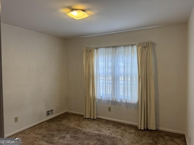 empty room featuring carpet flooring