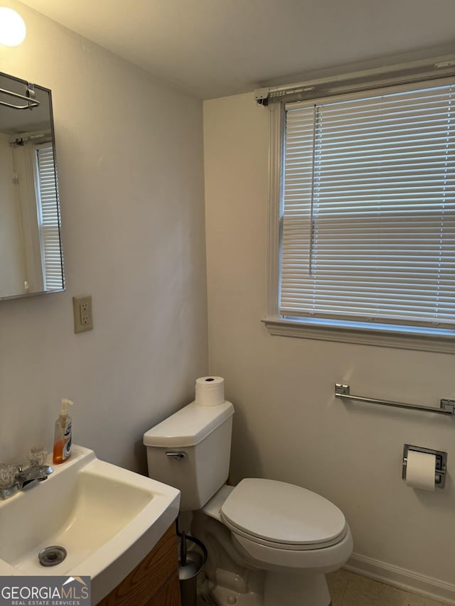 bathroom with sink, tile patterned floors, and toilet