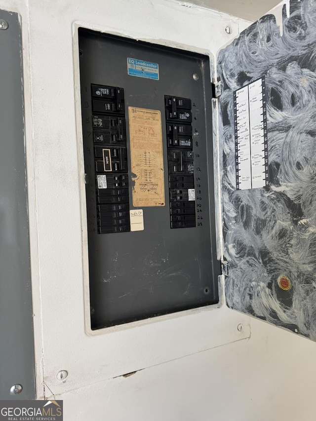 utility room featuring electric panel